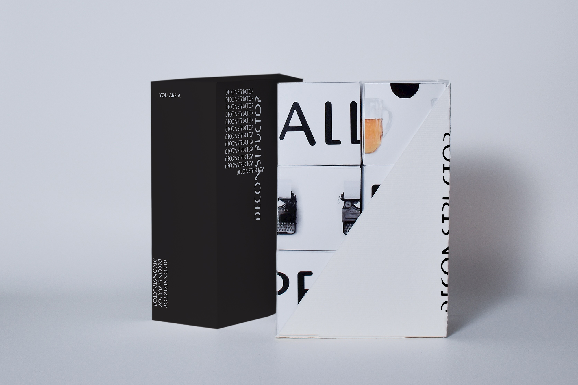 Open game box with game pieces neatly stacked inside. Landscape image.